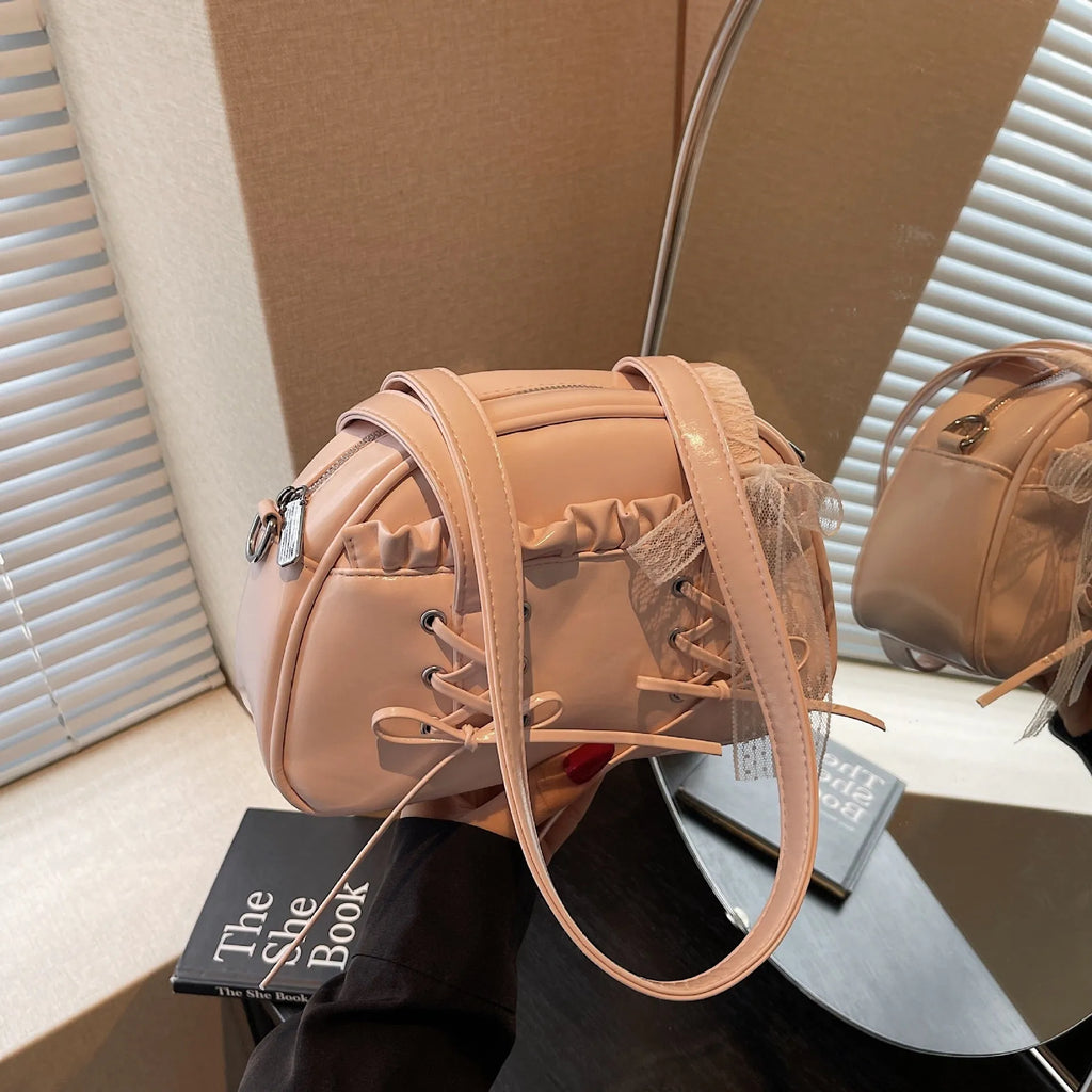 PU leather ladies shoulder bag with bandage bow design and decorative sewing thread in milky white colour