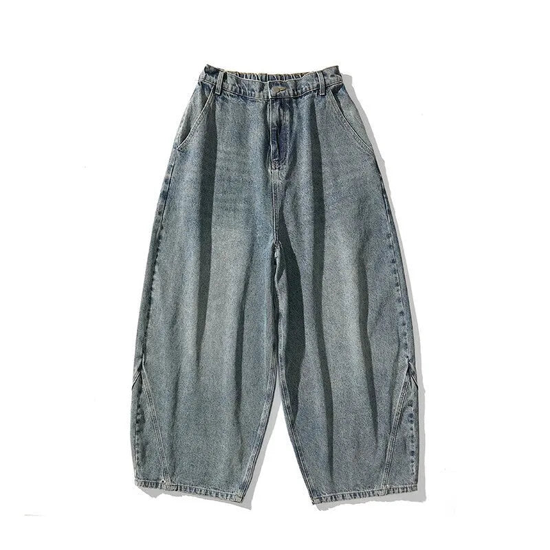 Men's plus size light blue baggy wide-leg jeans on a hanger, showing straight leg and low waist.
