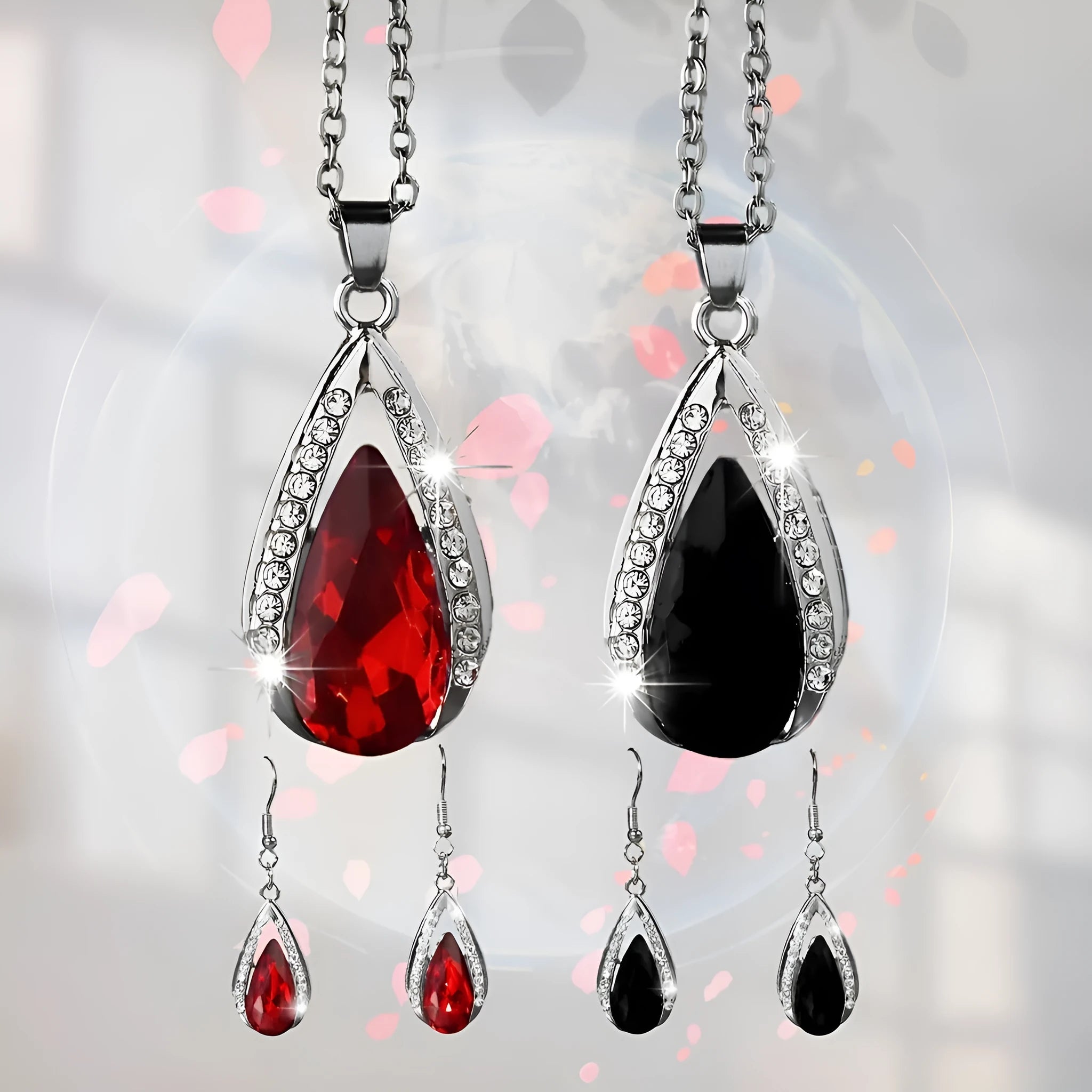 Alloy teardrop pendant necklace and matching earrings set in black or red finish.