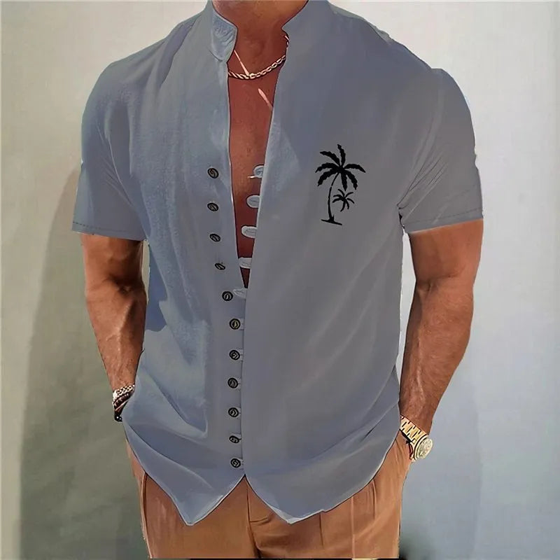 Youth wearing a short sleeve cardigan shirt with a geometric floral pattern in a polyester blend fabric.