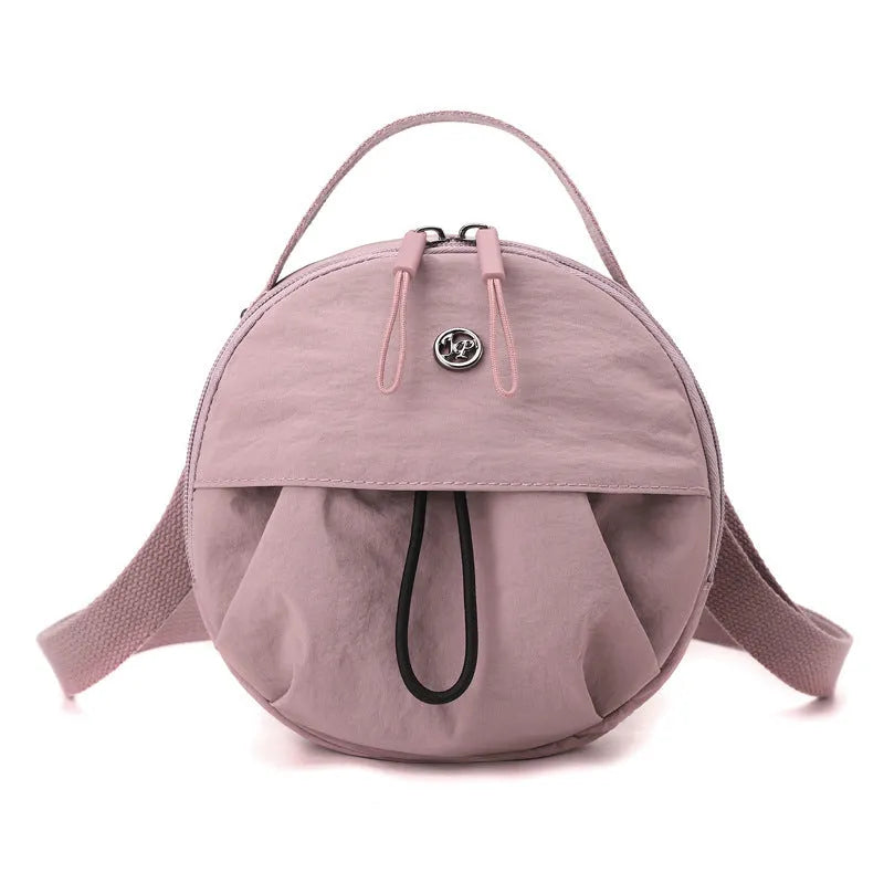 Nylon crossbody messenger bag in urban style with internal organisers, shown in a selection of colours.