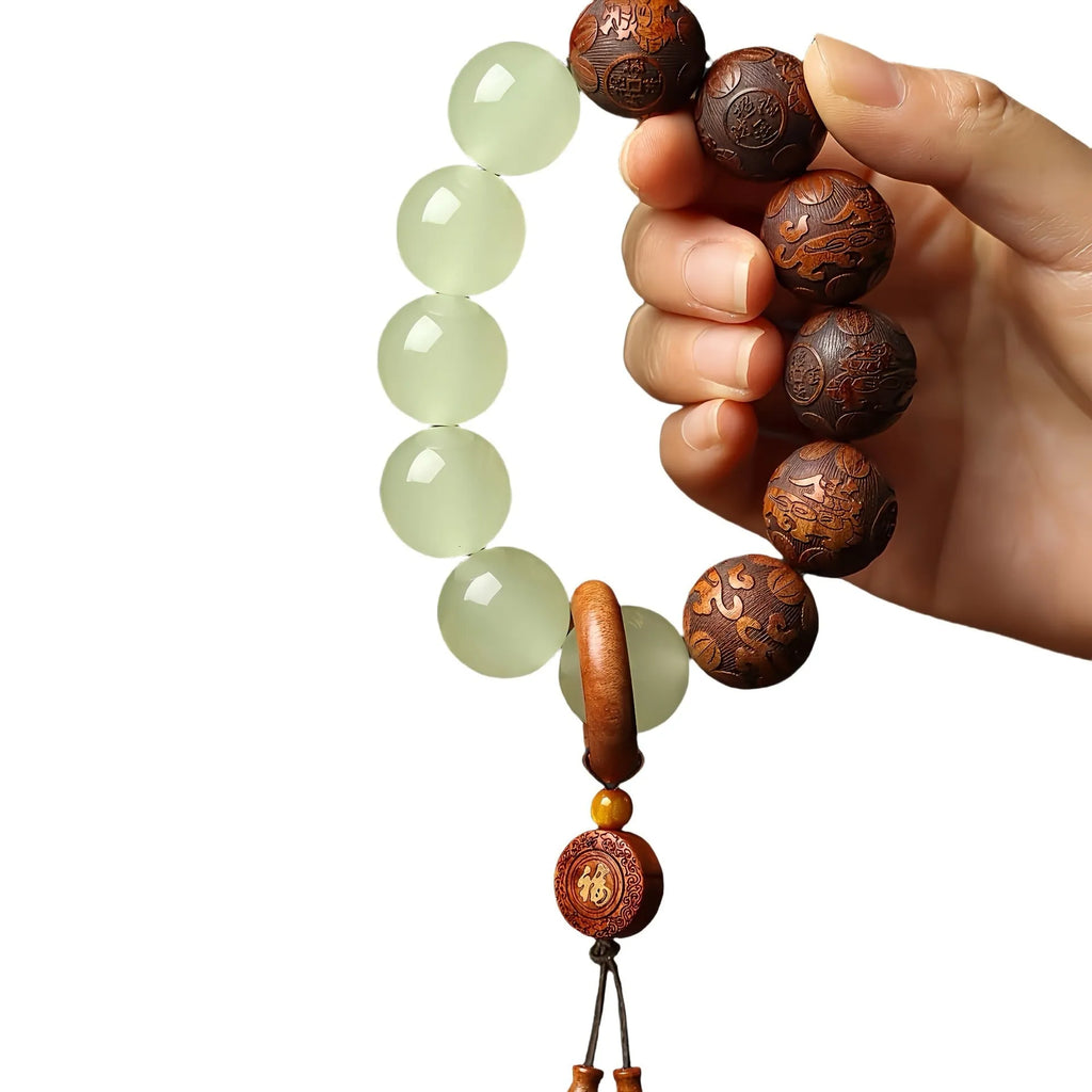 Rosewood bracelet with carved Fu character design showing 20mm beads on wrist
