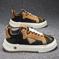 Men's beige low-top sneakers with elastic band and leather stitching on microfiber upper.