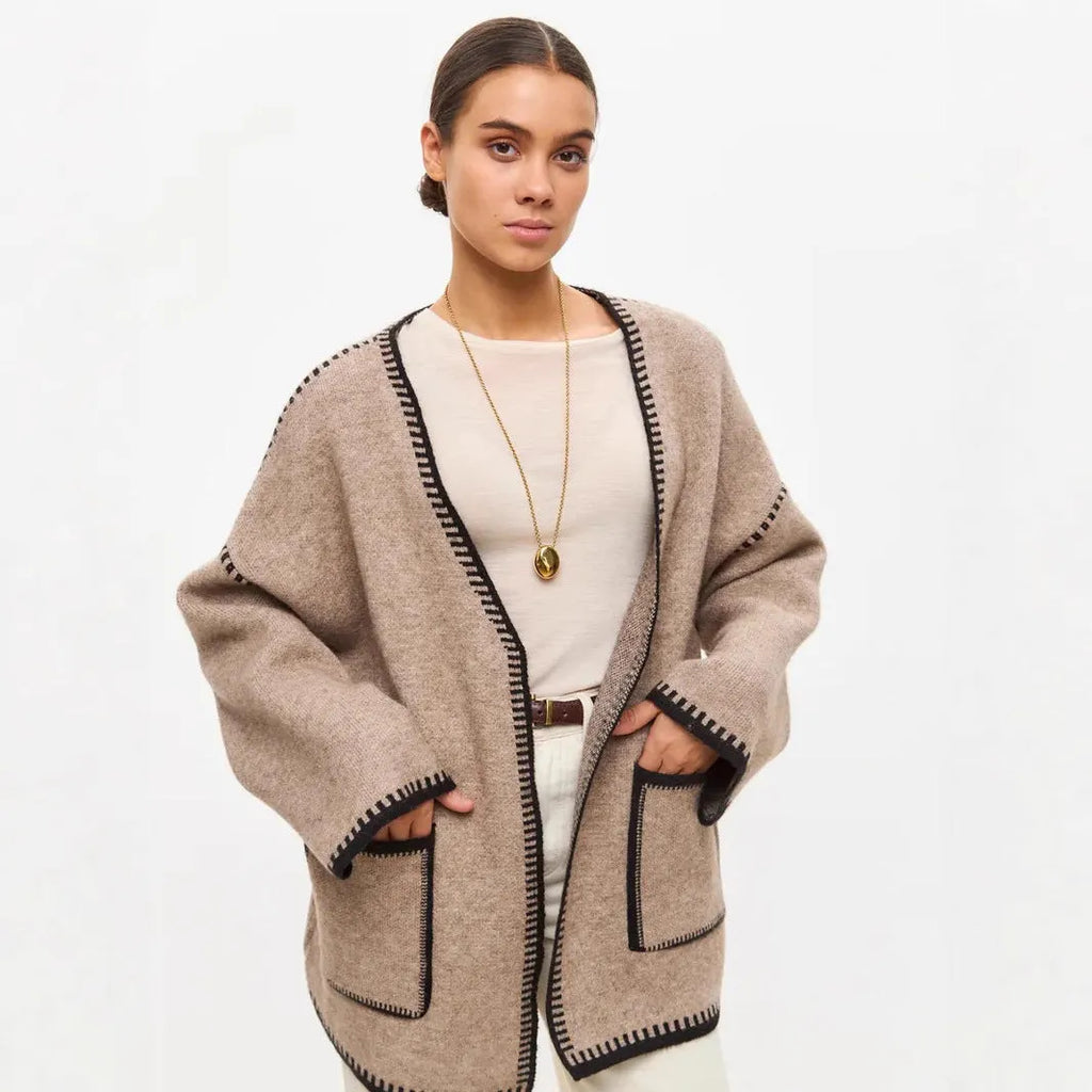 White lace-up knitted cardigan sweater coat with long sleeves and mid-length design