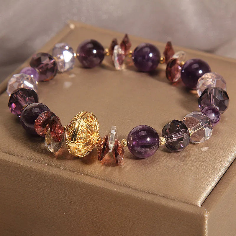 Purple crystal bracelet with pumpkin beads and rhinestone detailing on adjustable band