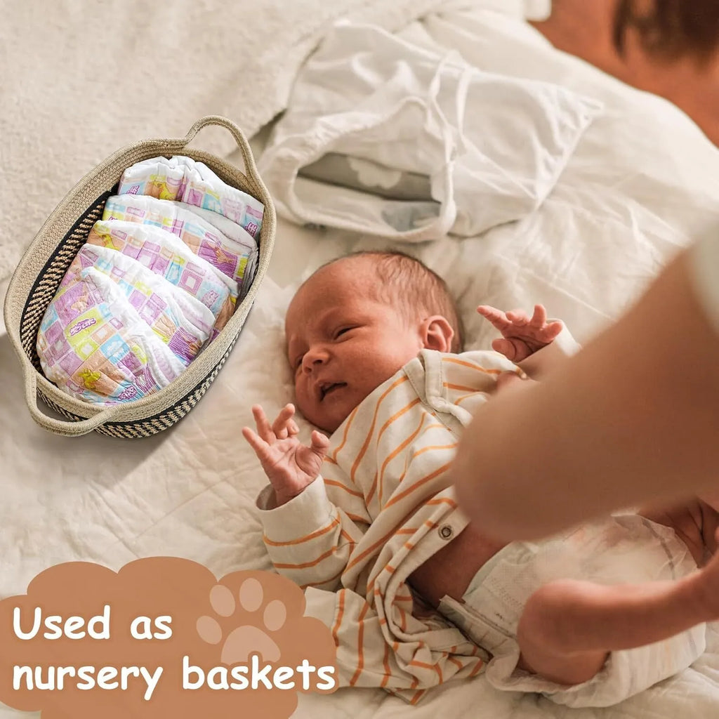Small light beige woven cotton rope storage basket with a wooden handle.