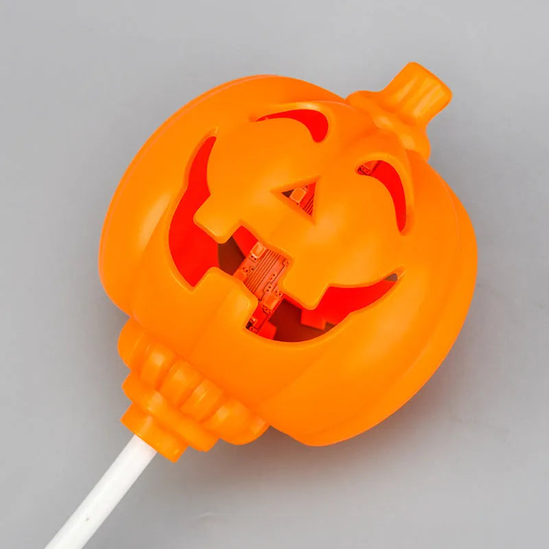 Plastic pumpkin-shaped decorative lamp with USB charging cable, showing purple or yellow light option.