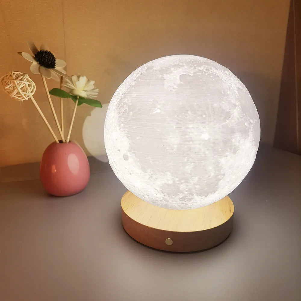 Rotating moon night lamp with wooden base showing wireless control and three colour settings