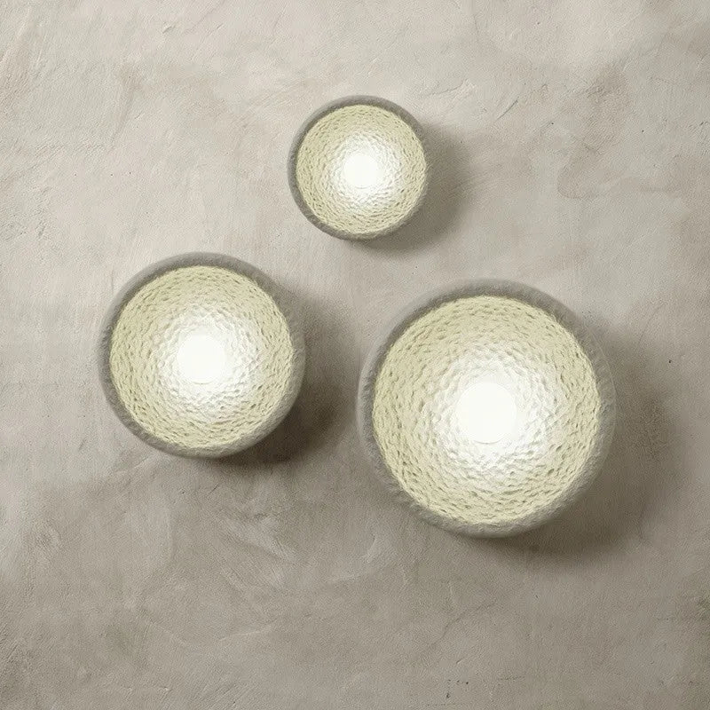 Japanese-style modern wall lamp with white resin shade in three size options.