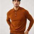 Man wearing a sapphire blue cashmere pullover sweater with a polo collar.