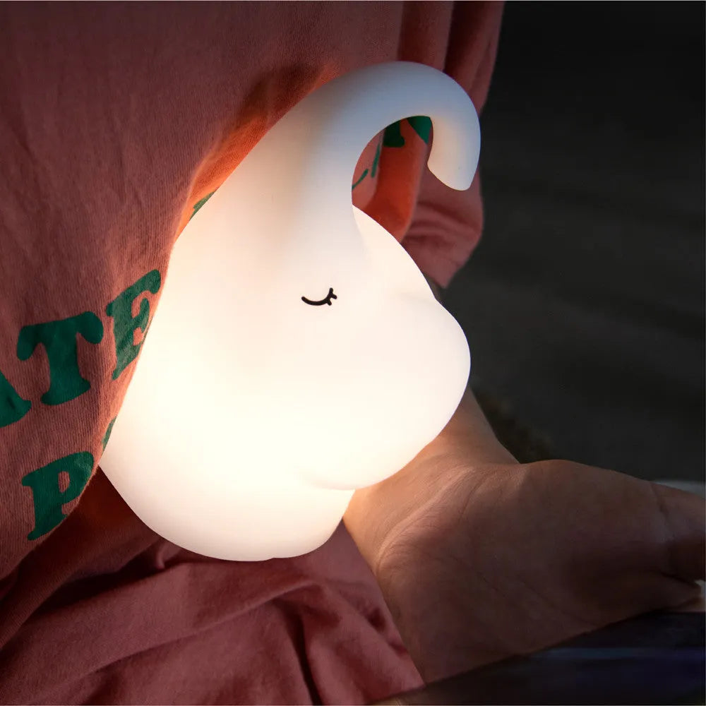 DOMI Elephant-shaped silicone and plastic night light with warm white glow.