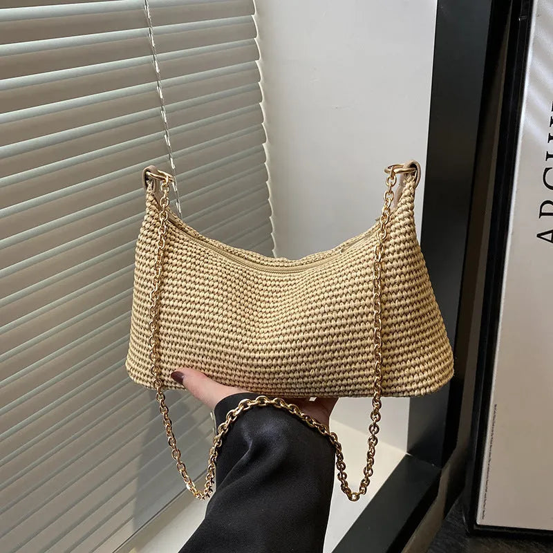 Woven straw crossbody handbag with square shape in khaki colour showing phone pocket