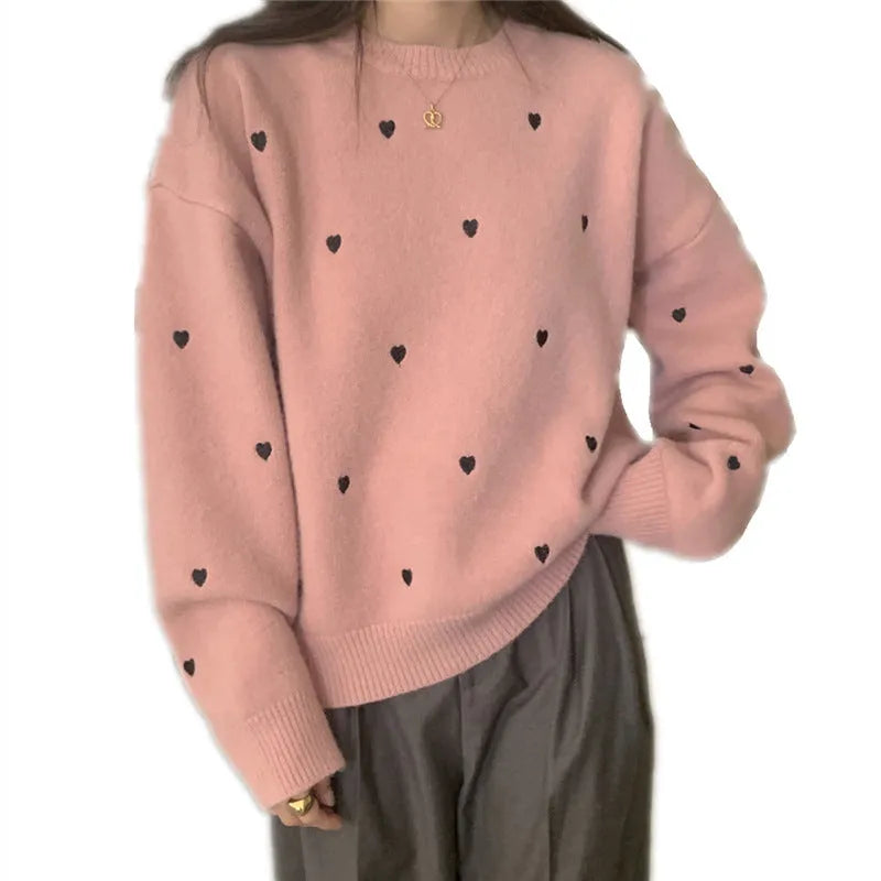 Loose beige women's pullover sweater with crew neck, long sleeves, and chest embroidery.