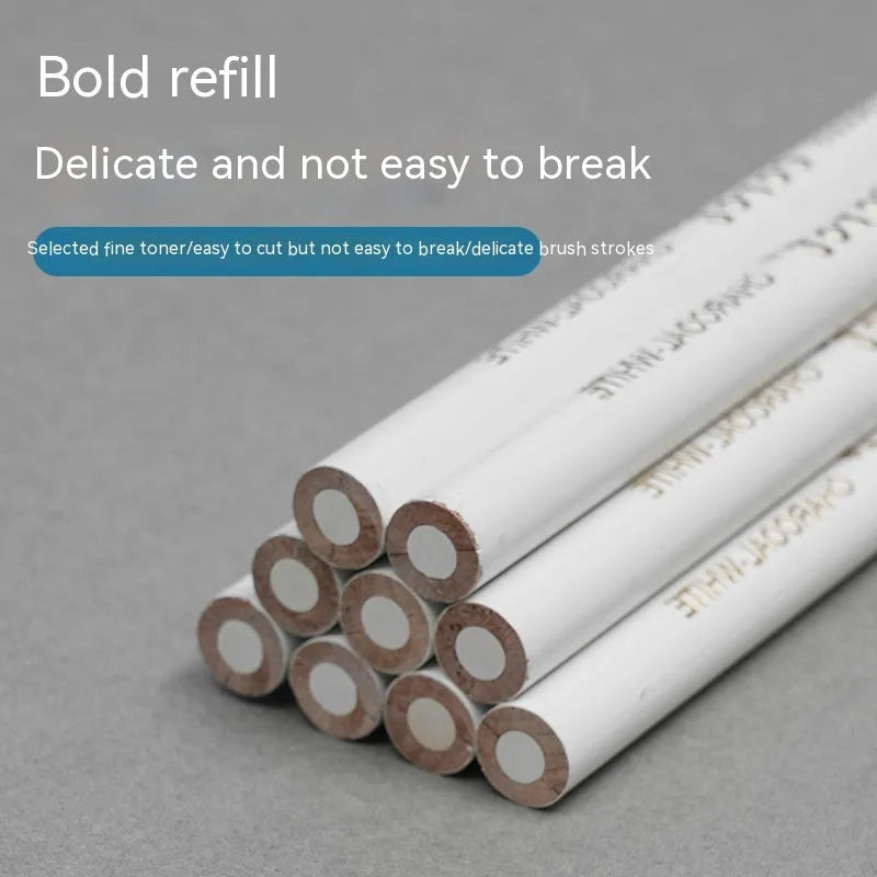 Set of three white charcoal drawing pencils with wooden casings.