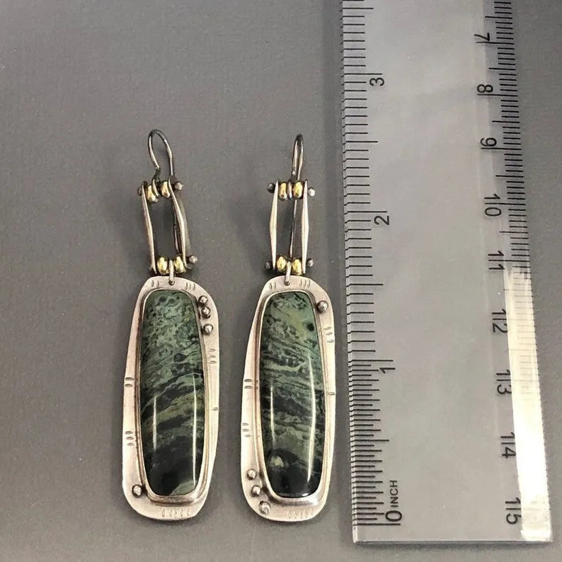 Geometric two-tone marble pattern alloy earrings with simple modern design