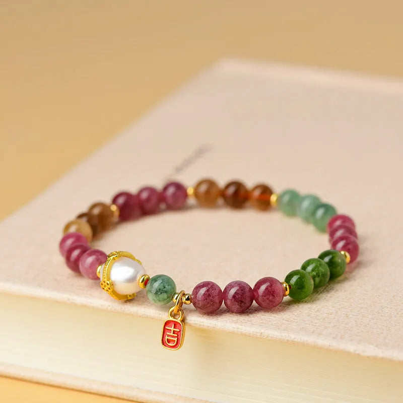 Geometric chalcedony bracelet with 6.5mm beads and natural crystal construction
