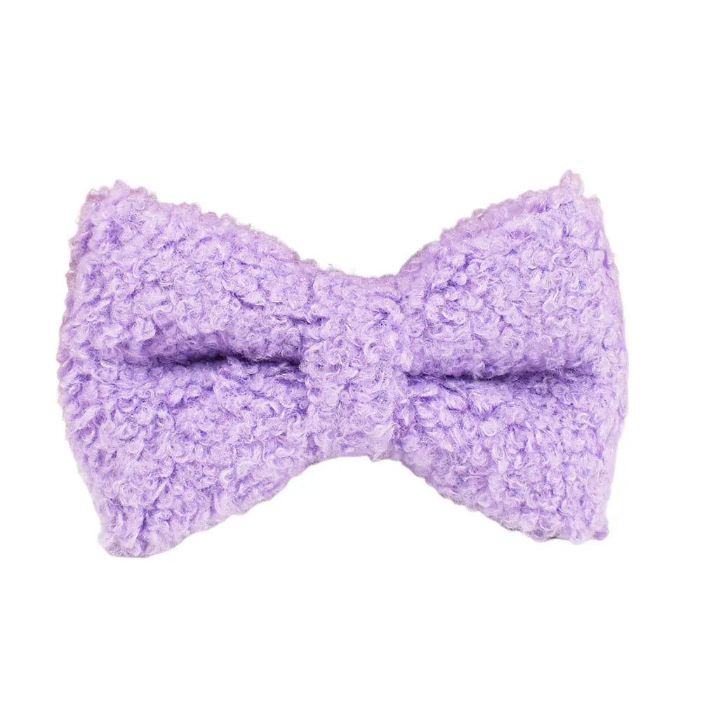Purple cloth dog collar, leash, vest and bow four-piece pet accessory set showing coordinated design