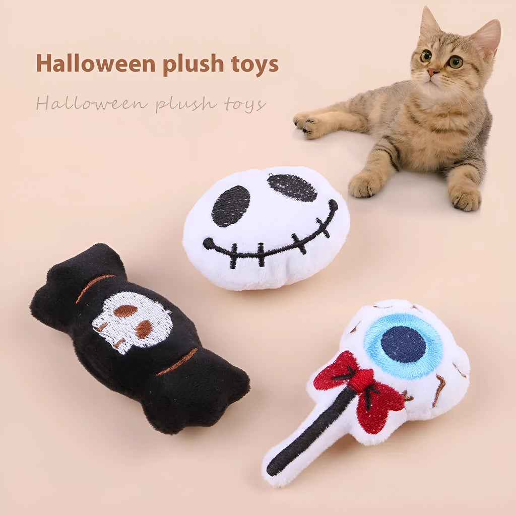 Small plush cat teaser toy with candy, eyes or skull design and feather attachment