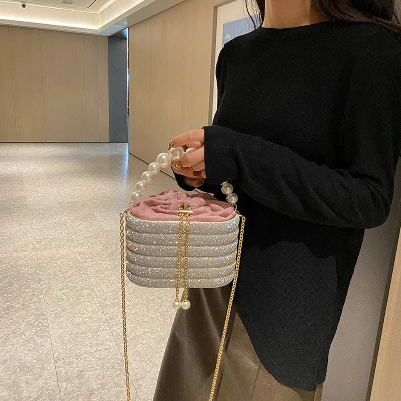Women's European retro style crossbody bag with pearl bead embellishments and soft PU construction in round suitcase shape