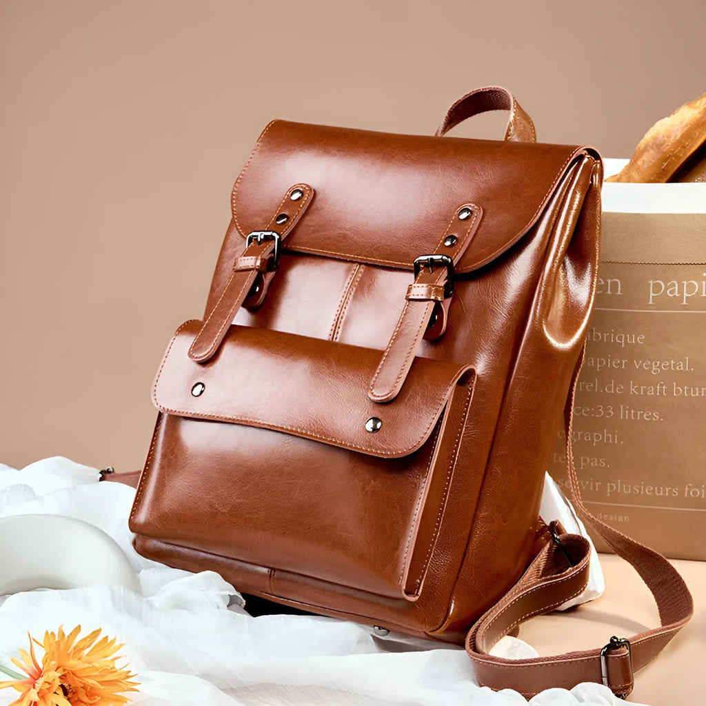 Genuine leather cowhide backpack with hard texture construction and internal lining for laptop organisation