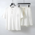 Men's loose fit apricot-coloured linen-style cotton short sleeve top and shorts two-piece set laid flat.