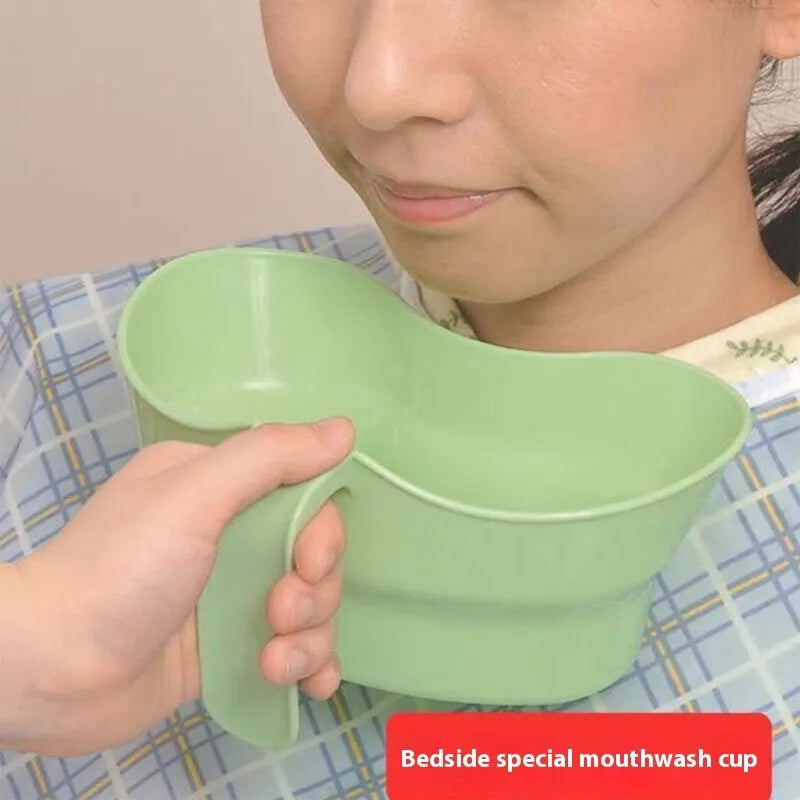 Green plastic gargle cup for bedridden patient oral care assistance