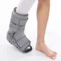 Grey Achilles tendon rehabilitation boot with fixed support design for rupture recovery