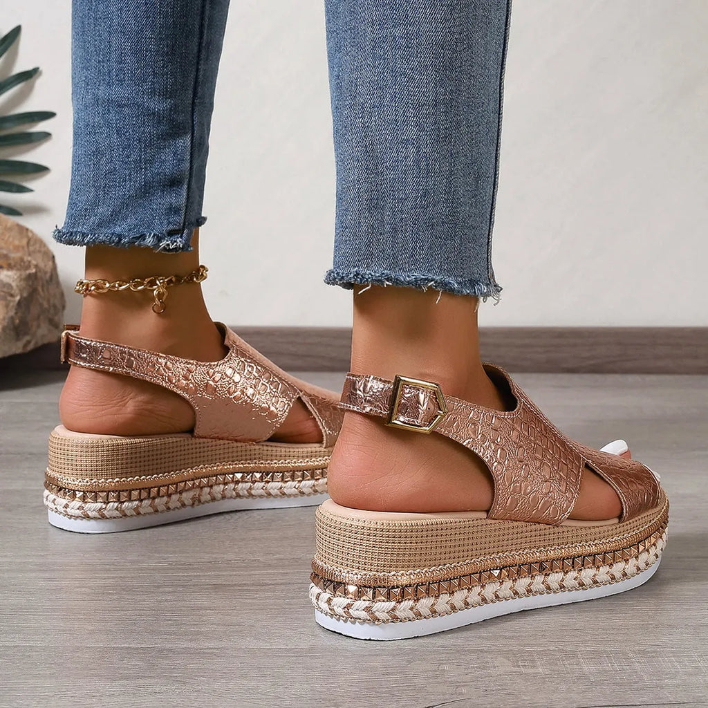 Gold roman sandals with round toe, ankle buckle, and hollow-out patterns on PU upper
