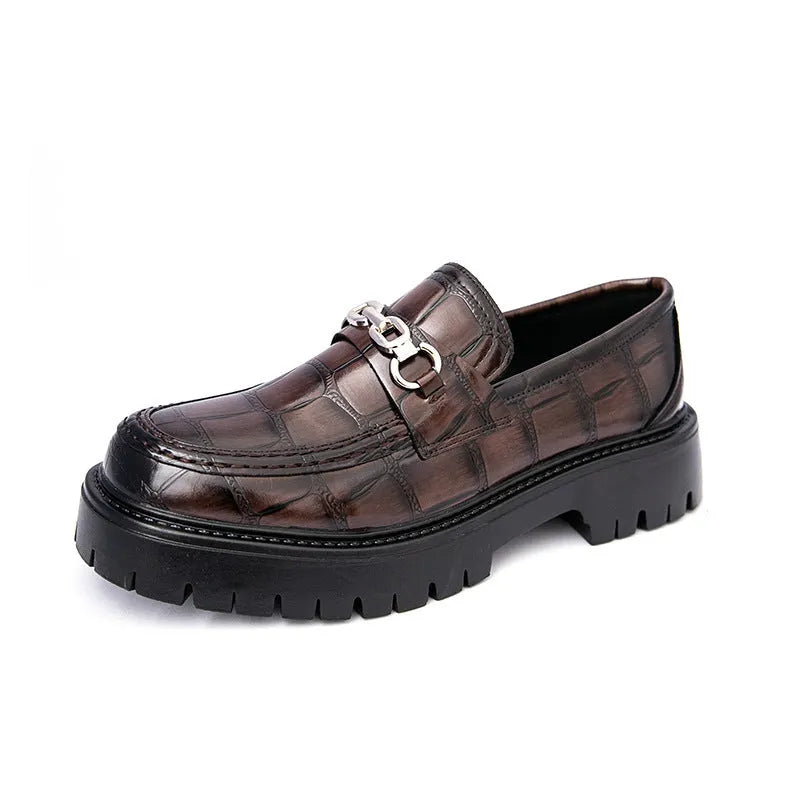Men's black crocodile pattern leather loafers with a flat heel.