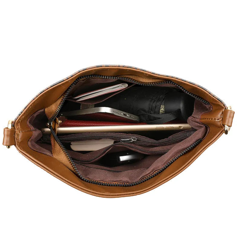 Brown soft leather messenger bag showing three-dimensional pocket and internal organisation compartments