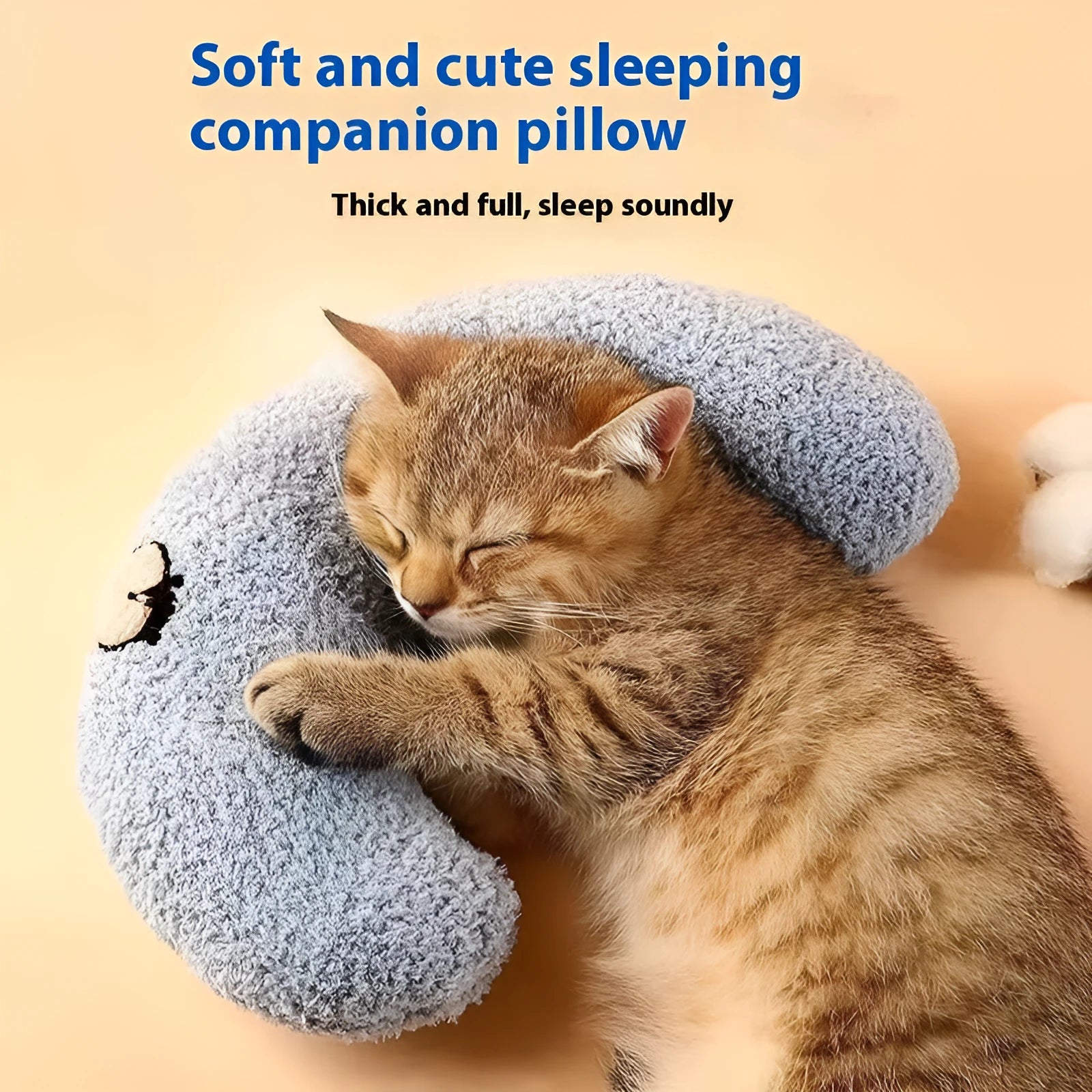 Blue cloth cat sleeping mat with a large U-shaped question mark pillow for neck support.