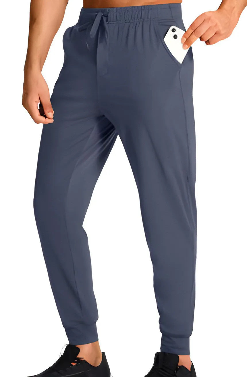 Men's loose fit polyester casual trousers shown in a solid colour, available in multiple sizes.