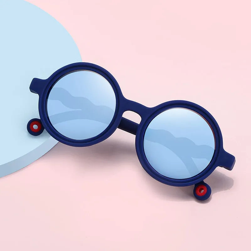 Children's sunglasses with UV400 protection, flexible nylon elastomer frame, blue colour, and polarizer included