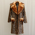Women's long leopard print artificial fur jacket with regular sleeves, shown on a model.