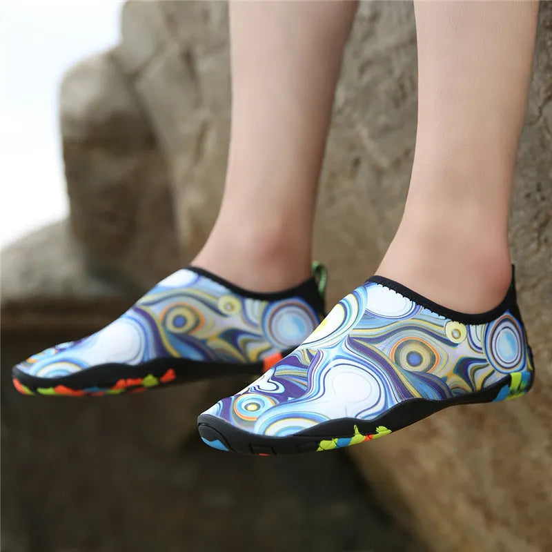 A pair of blue quick-dry beach wading shoes with Lycra uppers and EVA midsoles for water sports.