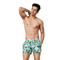 Green polyester large yard beach pants with loose fit, shown on a model, available in sizes S M L XL