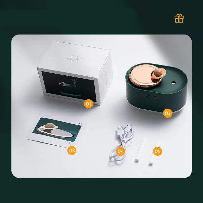 Green rotating planet-shaped USB humidifier with night light on a wooden surface