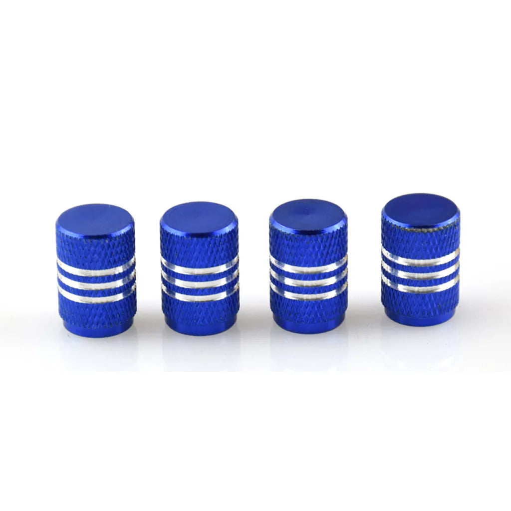 Set of coloured aluminium alloy car tyre valve caps showing stainless steel threads, displayed on a grey background.