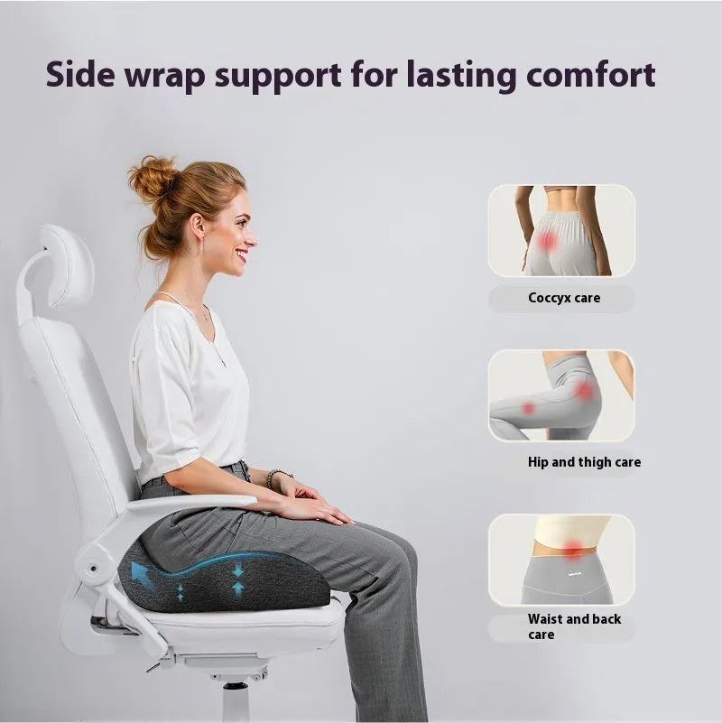 Light grey memory foam office chair cushion showing its thickness on a desk chair.
