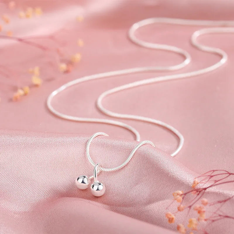 Silver cherry necklace on snake bone chain, adjustable length, Korean style jewellery for women.