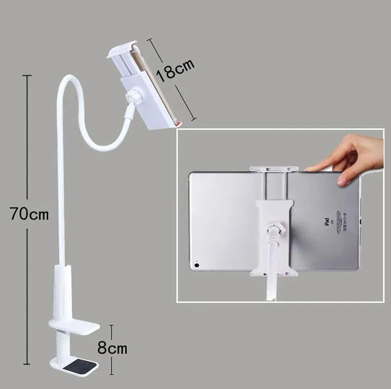 Black oversize bedside phone holder with a long adjustable arm mounted on a wooden table.