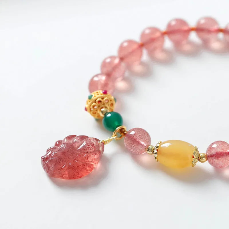 Women's crystal bracelet with strawberry quartz beads and nine tail fox charm