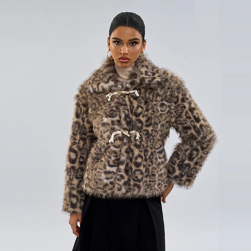 Women's leopard print coat with a buckle on the lapel.