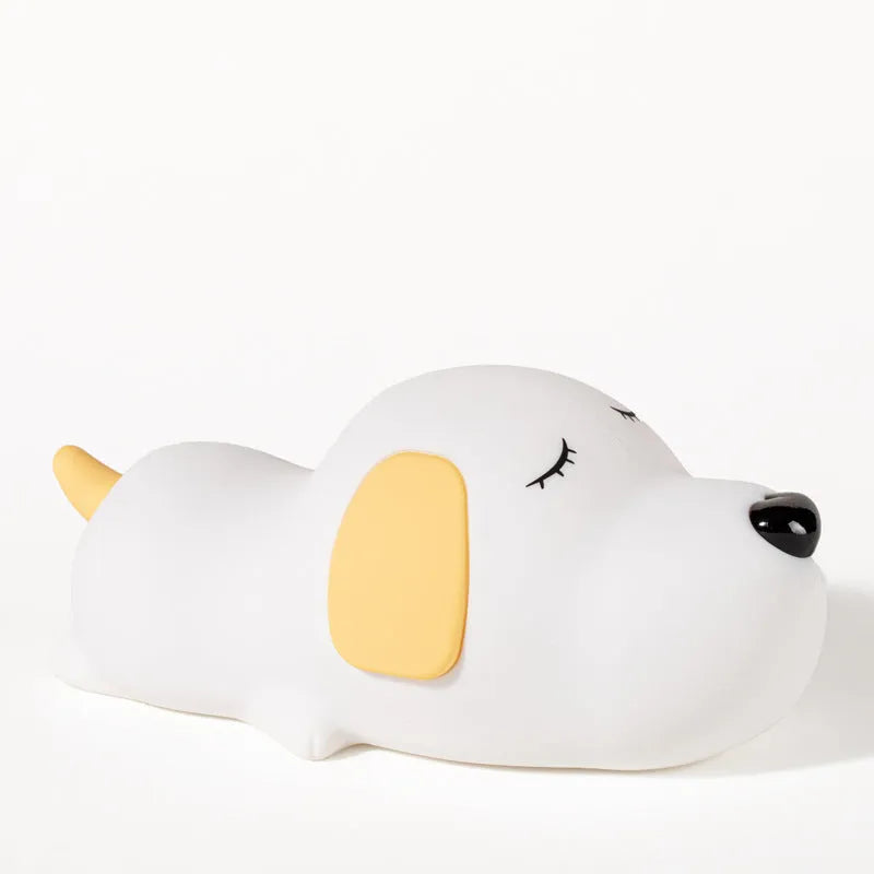 Cute two-colour cartoon dog silicone night lamp with USB cable for power.