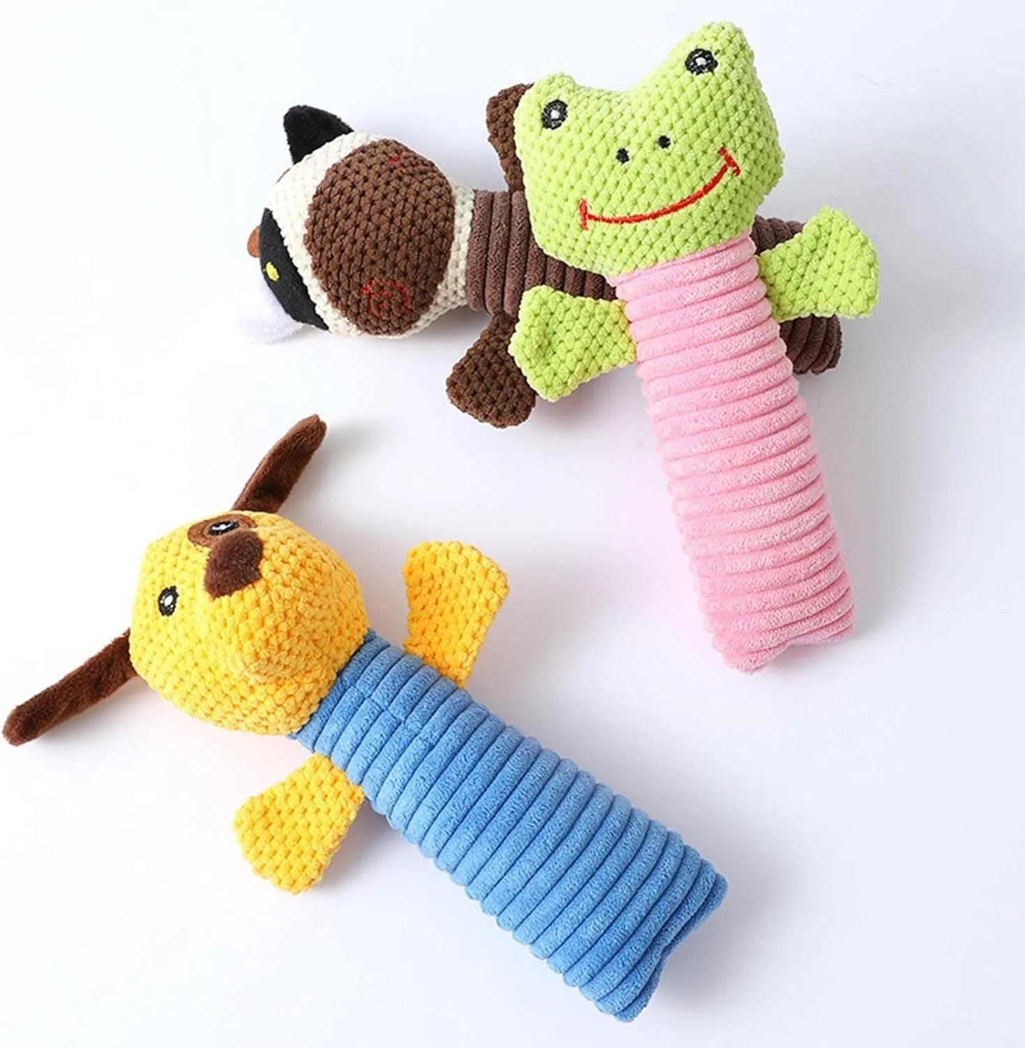 Squeaky stuffed dog chew toy in calf, frog, or puppy shape on white background