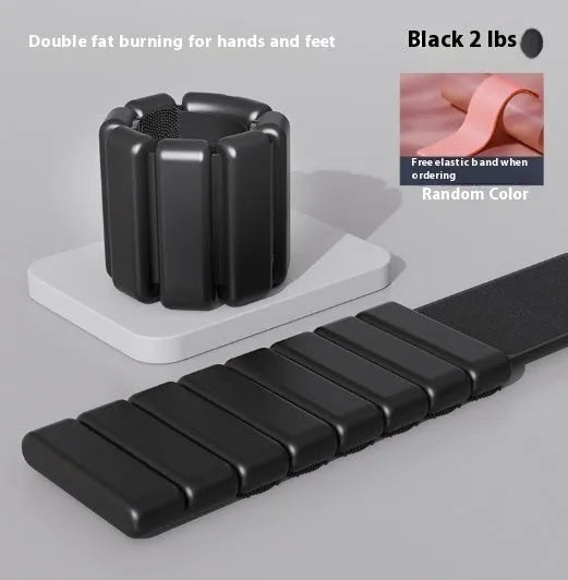 Silicone Velcro fitness weight bracelet in black, shown on a wrist.