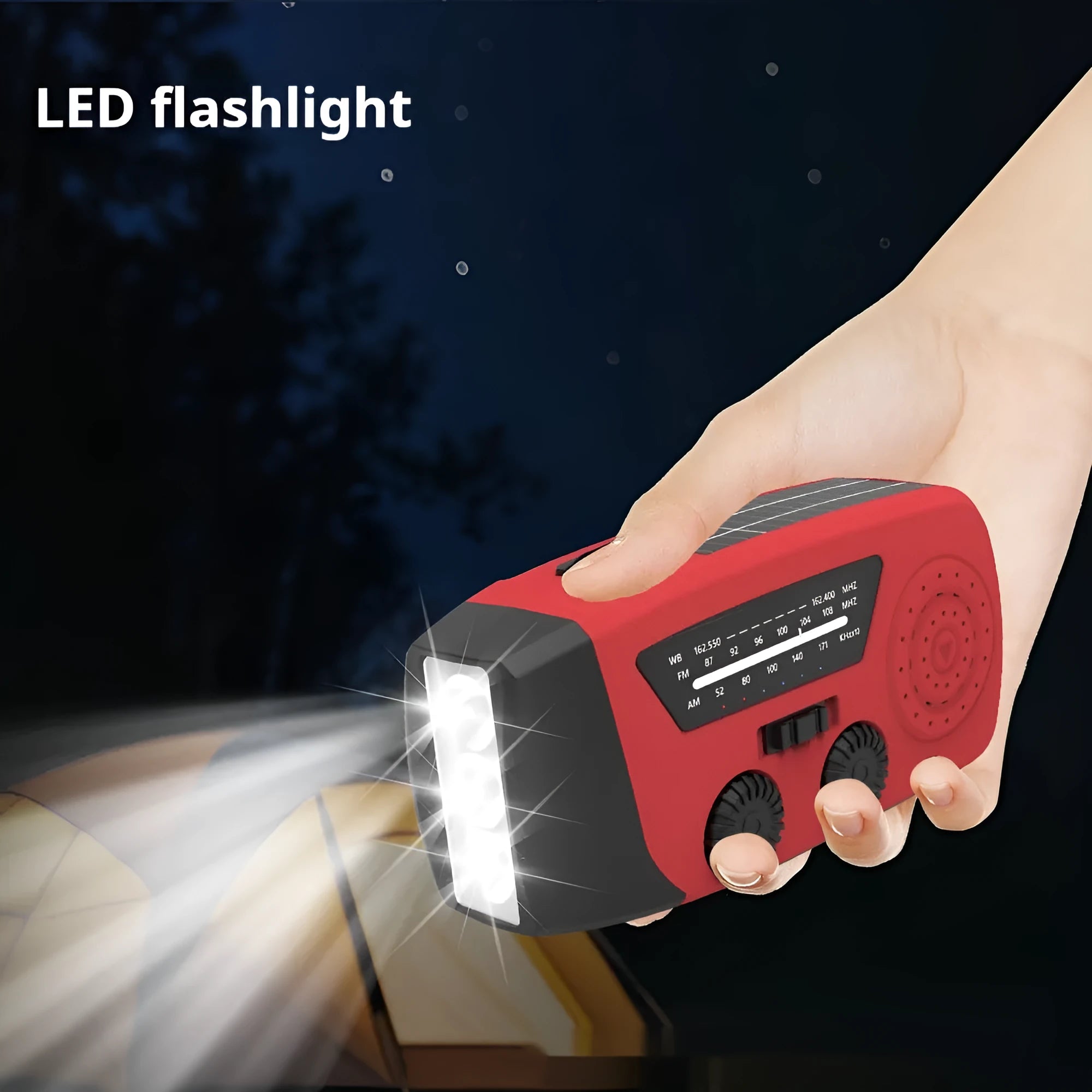 Red rechargeable emergency hand-crank radio with LED torch and USB port for disaster prevention