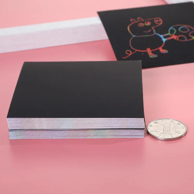Colour box containing 100 black scratch art cards and a wooden stylus for kids' creative painting.