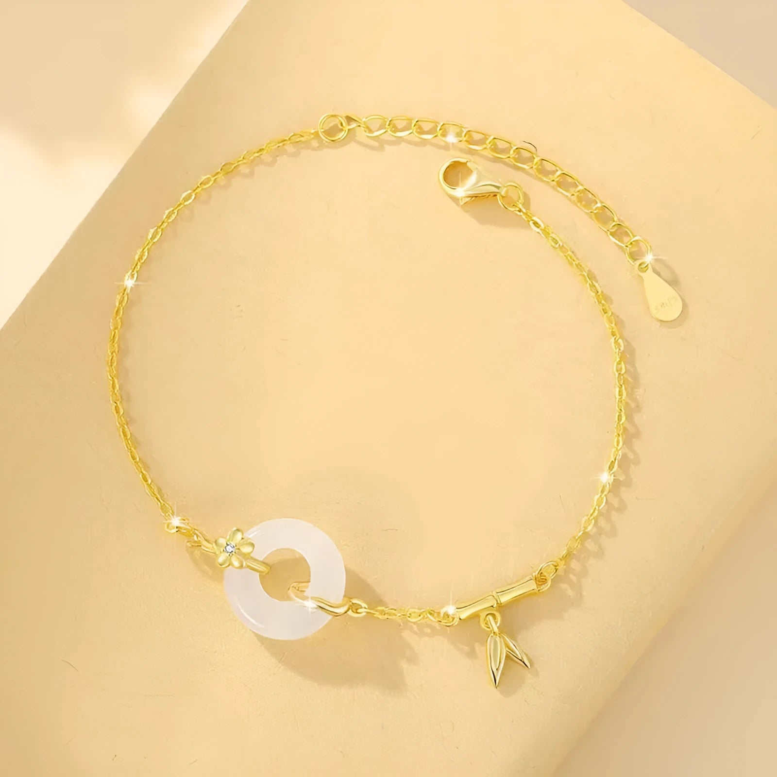 Women's silver bracelet with white chalcedony peace buckle charm and starry sky design