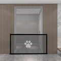 Portable folding dog barrier with plastic rod framework and cloth mesh in doorway with paw print pet doorsill